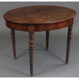A 19th century mahogany oval centre table with two-piece overhang top, plain frieze, & on bobbin-