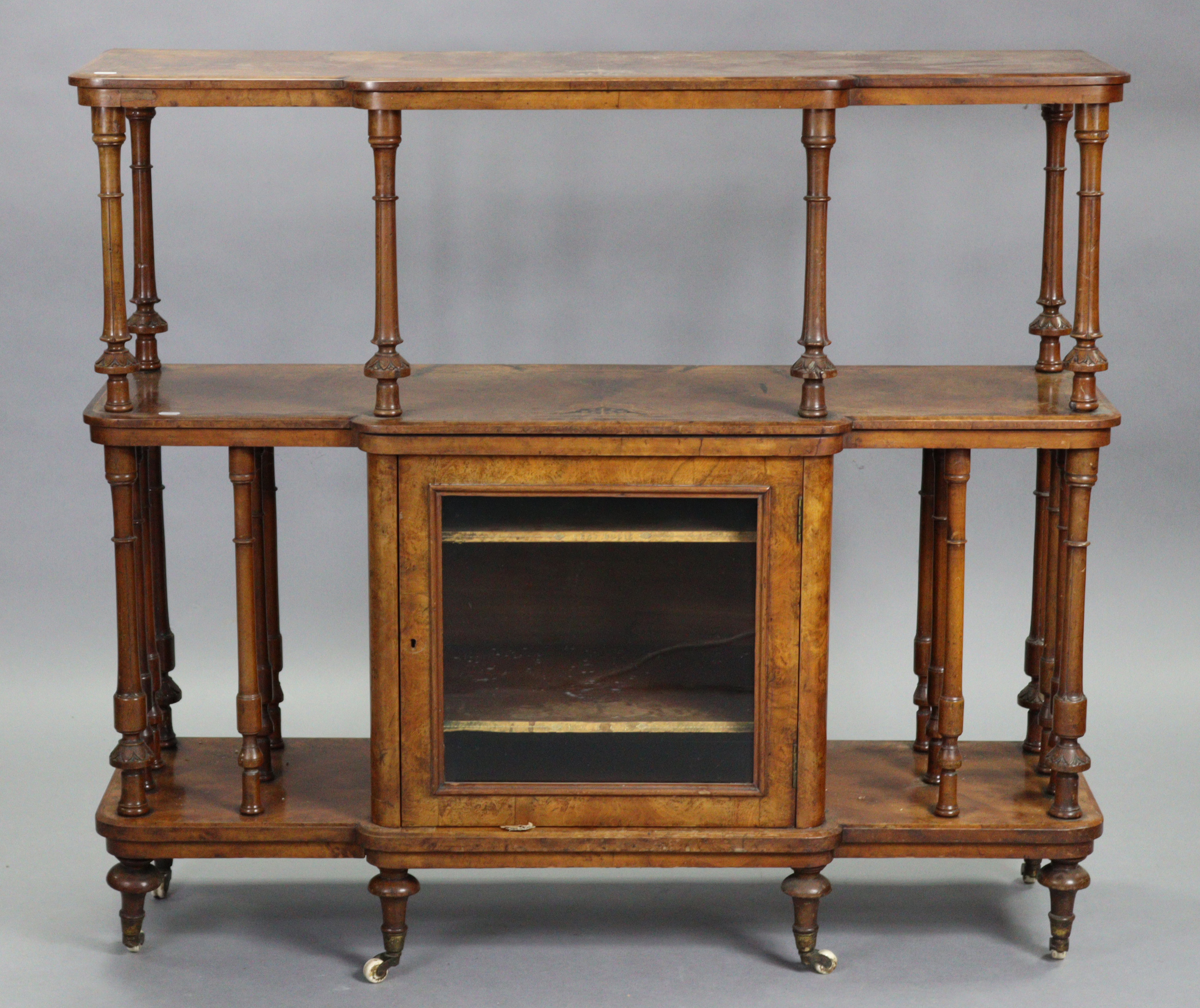 A Victorian inlaid burr-walnut three-tier side cabinet, the open centre with turned supports above a