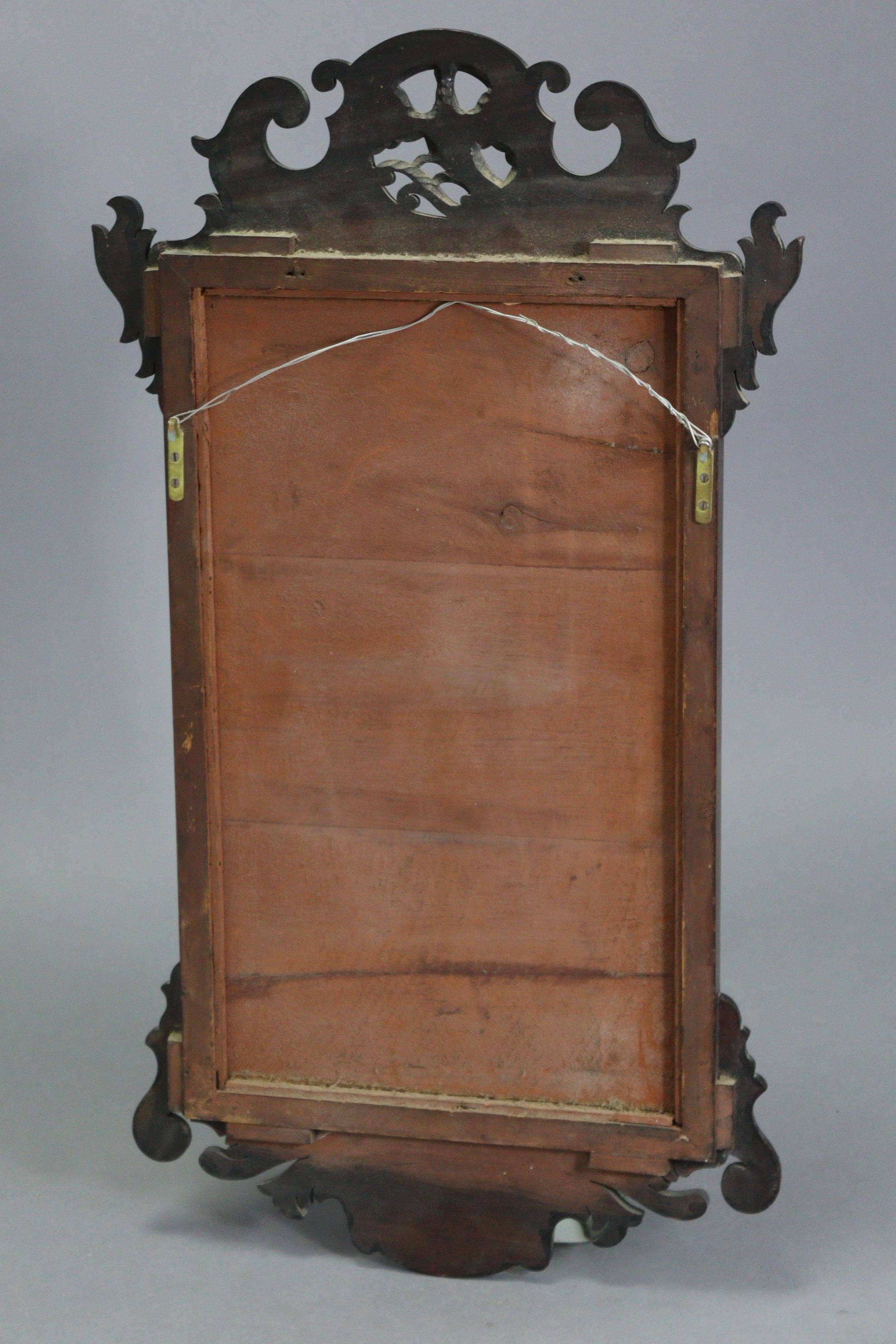 A George II-style rectangular wall mirror in fret-carved mahogany veneered frame with gilt ho-ho - Image 4 of 4