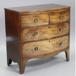 An early 19th century mahogany bow-front chest of two short & two long graduated drawers with