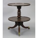 A George IV mahogany circular two-tier dumb waiter with moulded edge to each tier, on turned &