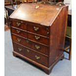 An 18th century figured walnut & herringbone crossbanded bureau, fitted numerous small drawers,