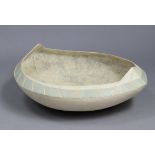 A large studio pottery coracle-shaped vessel with pointed ends & painted decoration in muted