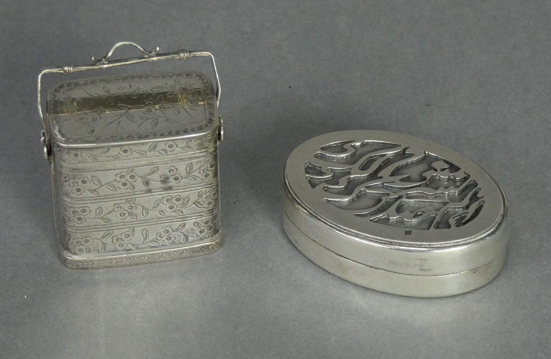 A Chinese silver small box in the form of a miniature picnic box of three stacking tiers, with