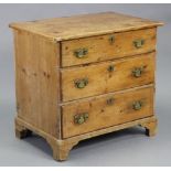 A late 18th/early 19th century pine small chest with plain rectangular top, fitted three long