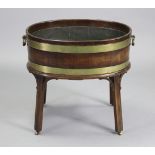 A MID-18TH CENTURY MAHOGANY & BRASS-BOUND OVAL WINE COOLER, with original tin lining, brass oval