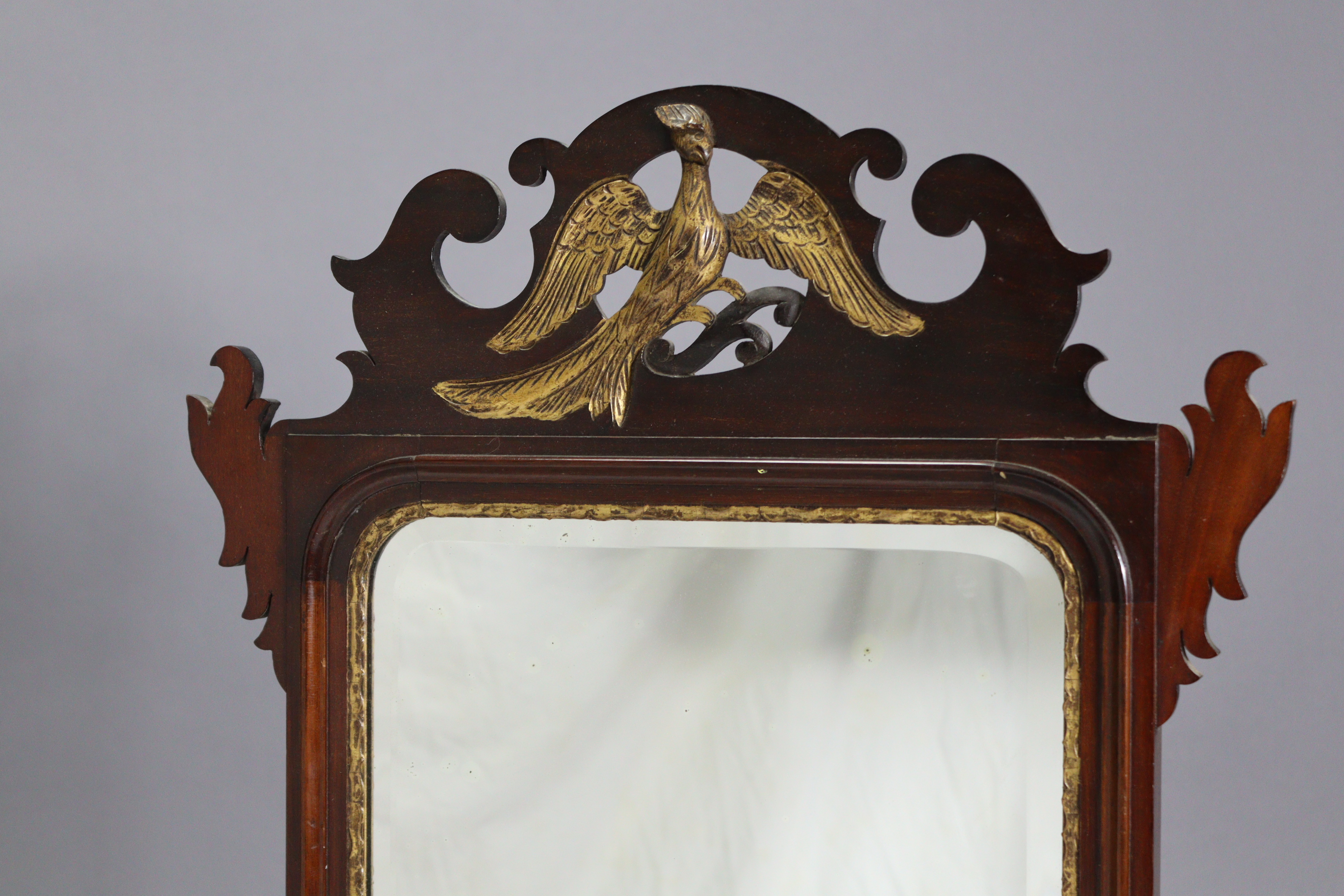 A George II-style rectangular wall mirror in fret-carved mahogany veneered frame with gilt ho-ho - Image 2 of 4