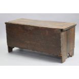 A 17th century oak coffer with original hinges, plain front & sides, on short shaped stock feet, 47”
