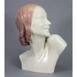 GUERO. An art Deco ceramic bust of a young woman, her head in profile turned to the left, signed