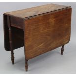 A mahogany rectangular drop-leaf dining table fitted with a drawer to one end, on ring-turned &