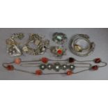 A 9ct. necklet of flattened links “ long (gm., w.a.f.); a silver charm bracelet; Hirco ladies’
