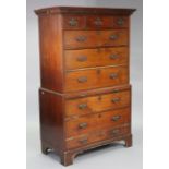 A late 18th/early 19th century mahogany chest-on-chest with moulded dentil cornice, fitted with an