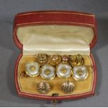 A pair of French gold, white enamel, & mother-of-pearl cuff-links, the circular panels with ribbon-