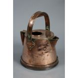 An early 20th century Arts & Crafts copper watering can with overhang swing handle & tapered