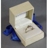 A 9ct. gold ring of open scroll design, set cluster of four sapphires & three diamonds; size: P,