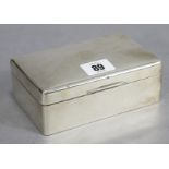 A George V silver rectangular cigarette box with rounded corners & engraved monogram to the hinged