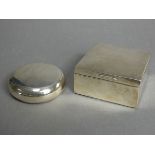 A George V silver compressed round pocket tobacco pouch with squeeze release to the hinged lid, 3”