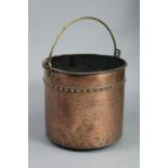 A Georgian riveted copper cylindrical log bucket with overhang handle, “ high.