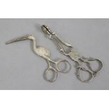 A pair of William IV silver scissor-action ribbon-pullers cast in the form of a stork, Birmingham