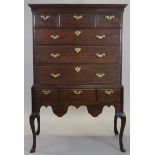 A mid-18th century MAHOGANY CHEST-ON-STAND, the upper part with moulded cornice above three