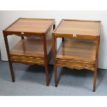 A pair of teak rectangular two-tier bedside tables in the Georgian style, each with slightly