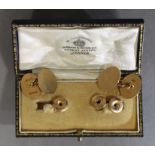 A pair of 15ct. gold cuff-links with plain oval panels, London hallmarks for 1920 (9.8 gm); &