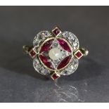 A late Victorian ring with lobed panel set rubies, & rose diamonds centred by a pearl, to an un-