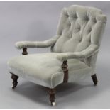 A Victorian mahogany frame armchair, with buttoned back & arms & padded seat upholstered light