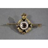 A 9ct. gold & enamel Army Chaplain’s brooch with crowned wreath, Maltese cross centred by a