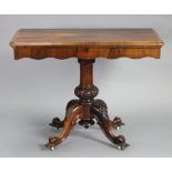 A Victorian rosewood tea table, with moulded edge to the rectangular fold-over top & shaped