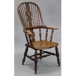 A 19th century ash & elm slat-backed Windsor elbow chair with baluster turned supports, hard moulded