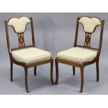 A pair of Edwardian mahogany occasional chairs with inlaid decoration to the pierced splat backs,