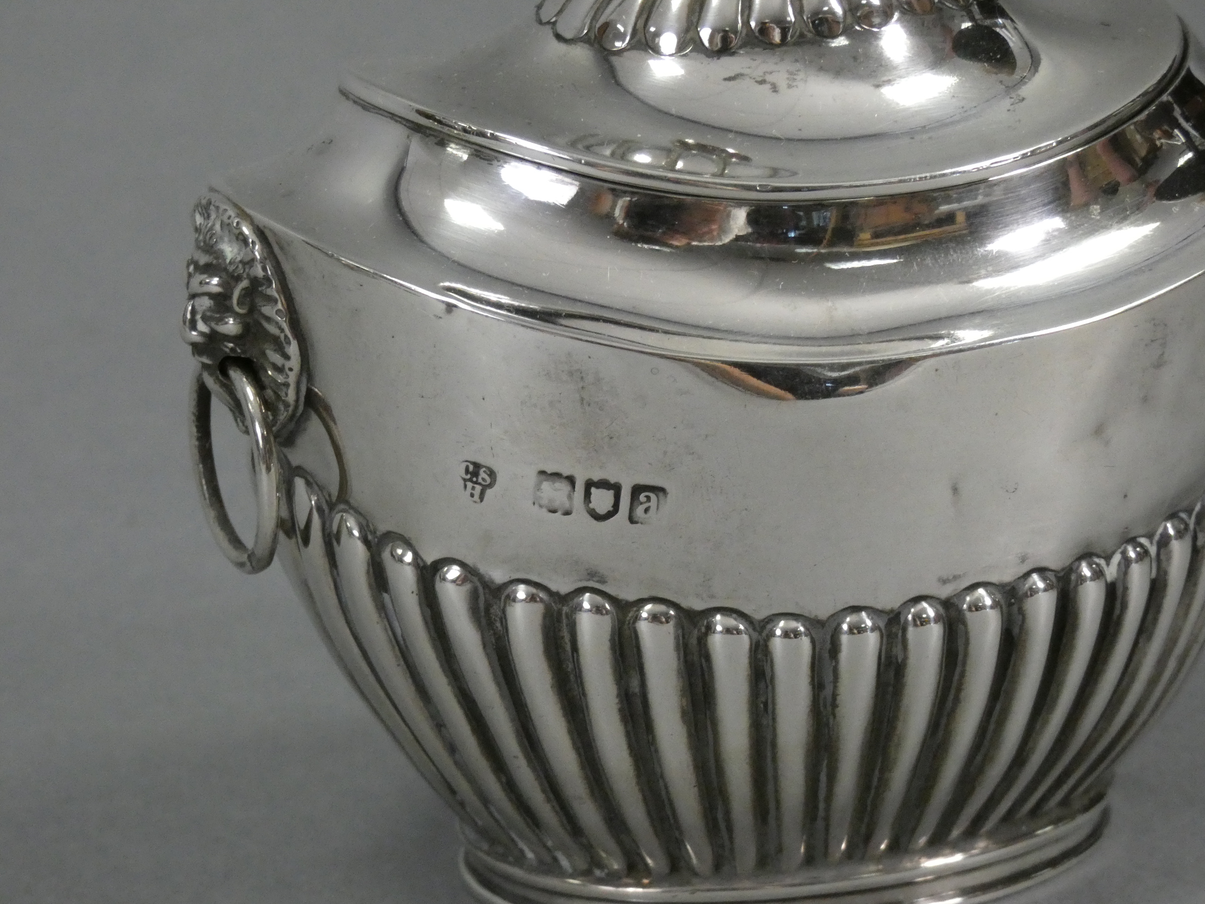 A late Victorian silver tea caddy of oval semi-fluted form, with hinged lid & lion-mask ring - Image 2 of 2