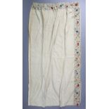 A pair of late 18th/early 19th century crewel-work curtains of cream ground, with multicoloured