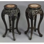 A pair of Chinese jardiniere stands, with carved & pierced floral decoration, the circular tops