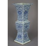 A 19th century Chinese blue & white porcelain gu-shaped vase of square cross-section, painted all-