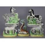 A late Victorian Staffordshire pottery model of a zebra on mound base, 4¾” high; a late Kent-type