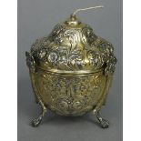 An Edwardian silver-gilt string box of ovoid shape with pull-off ogee lid, all-over embossed