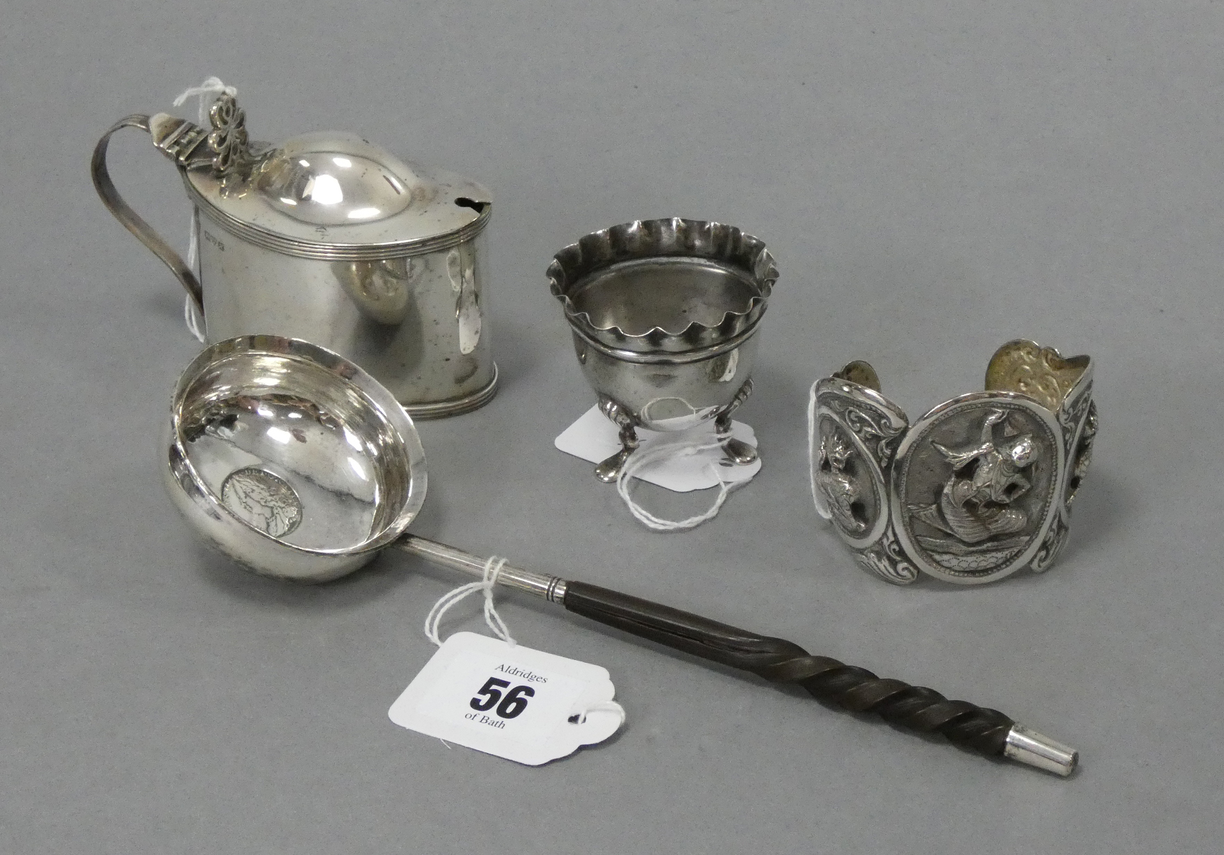 An 18th century toddy ladle with circular “coin” bowl inset George II 1757 shilling, with short