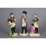 Three continental porcelain standing male figures of military officers, one labelled to the base: “