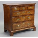 An 18th century burr-walnut & feather-banded chest, with cavetto cornice & canted corners, fitted