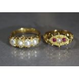 A Victorian 15ct. gold ring set two small rubies centred by a split pearl, Birmingham hallmarks