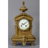 A 19th century French mantel clock, the 3.25" dia. white enamel convex dial with blue roman numerals