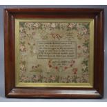 A mid-19th century needlework sampler, inscribed “Mary Schofield, Her Work, 1845”, with flowers,