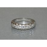 A diamond ring set row of seven graduated brilliants to an 18ct. white gold shank; size: O, weight