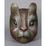 An early/mid-20th century carved wooden theatrical cat mask, with pierced eyes & painted