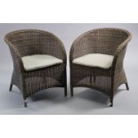 A pair of faux wicker tub-shaped garden/conservatory chairs, weather resistant, each with padded