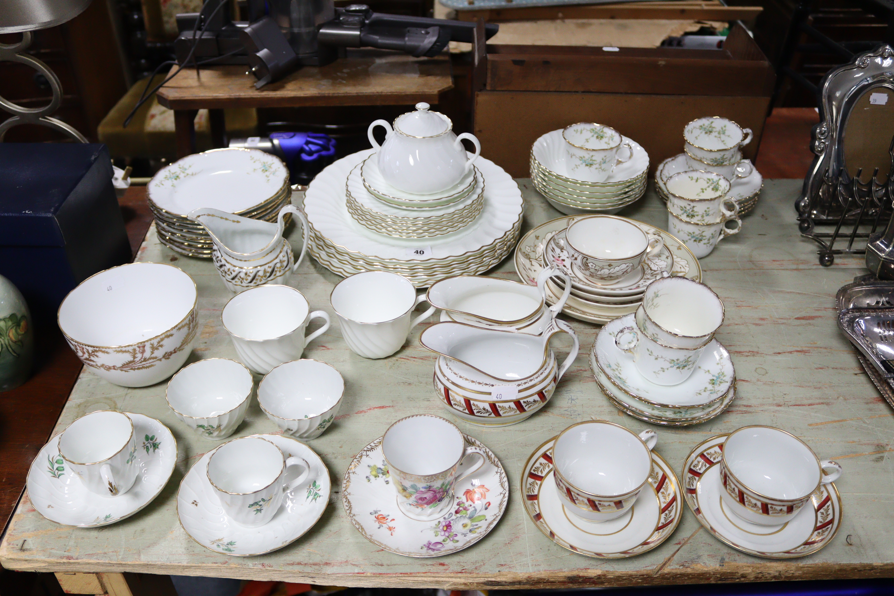 A Victorian floral decorated seven-piece part tea service; a Wedgwood bone china “Gold Chelsea”