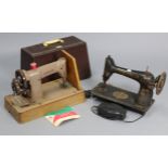 Two Singer sewing machines, one with case; together with various decorative ornaments, etc.