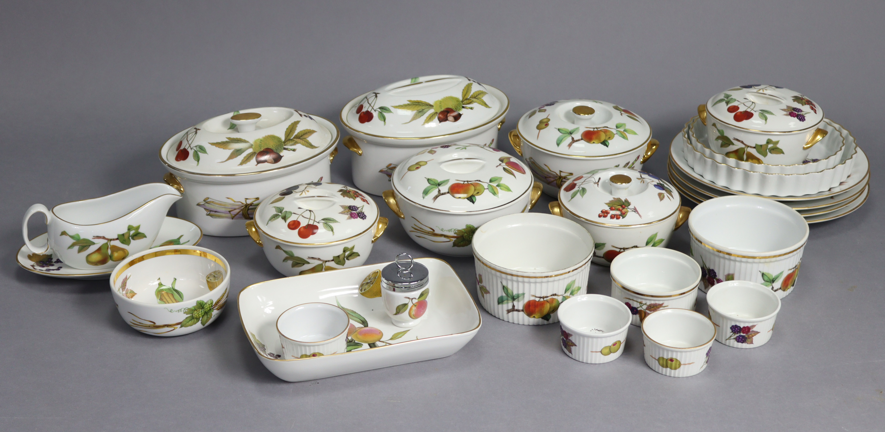 Two Royal Worcester “Evesham” oval casserole dishes, 9½” wide; five ditto circular tureens; &